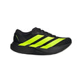 Black running shoe with bright yellow stripes on a light gray background